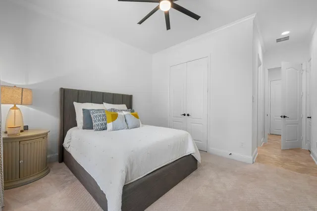 a bedroom with a bed and cabinets