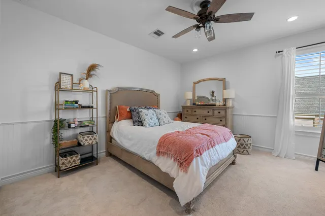 a bed room with a bed and a window