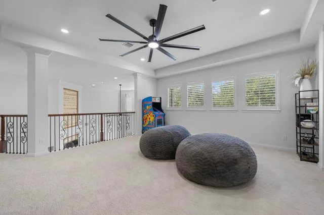a bedroom with furniture and a window