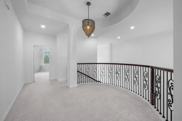 a view of a hallway with a chandelier