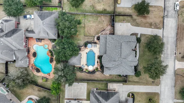 an aerial view of houses with outdoor space