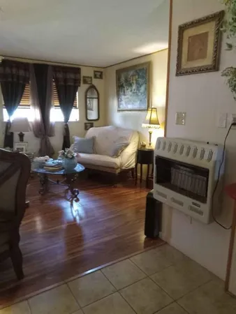 a kitchen with a sink a stove and cabinets