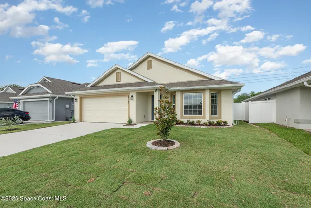 a front view of a house with a yard and porch