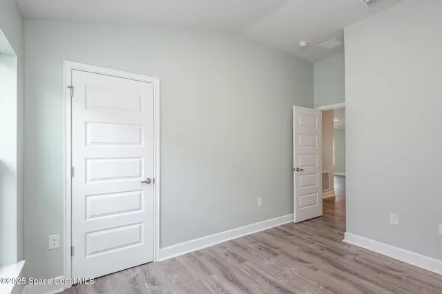 a view of a kitchen with a sink and a window