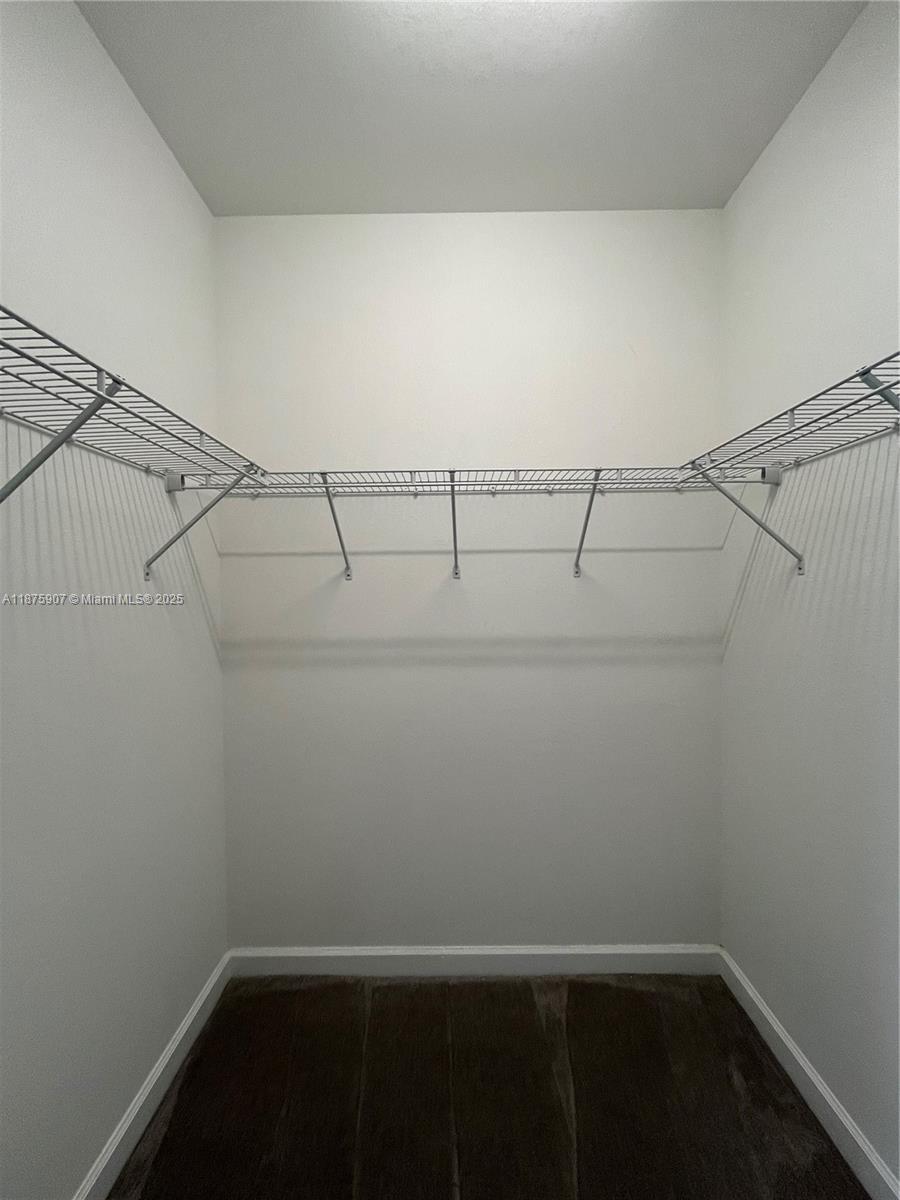 10008 Southwest 228th Terrace Miami, FL 33190 - Photo 18 of 46 a view of a room with racks on the wall