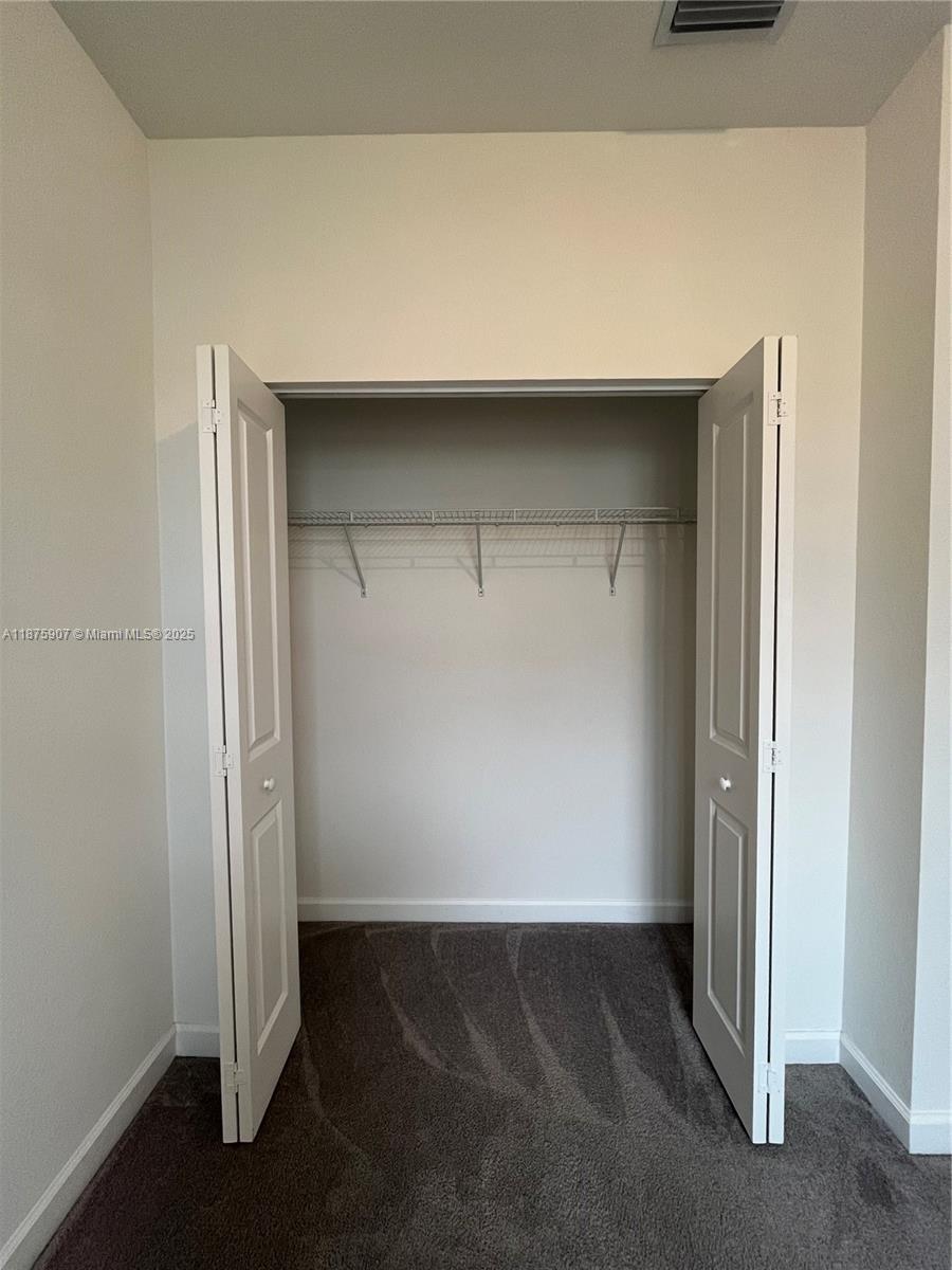 10008 Southwest 228th Terrace Miami, FL 33190 - Photo 23 of 46 an empty room with closet