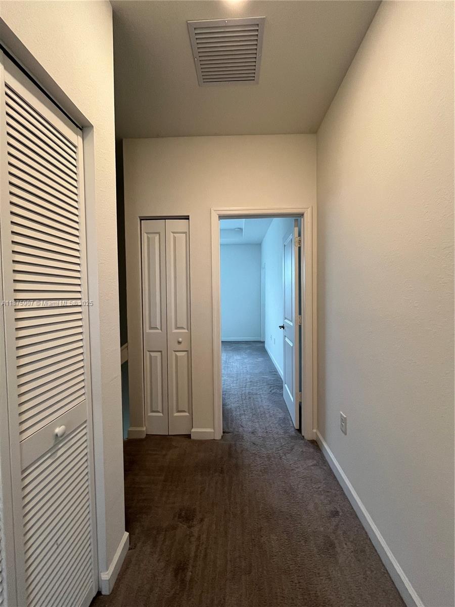 10008 Southwest 228th Terrace Miami, FL 33190 - Photo 26 of 46 a view of a hallway with wooden floor