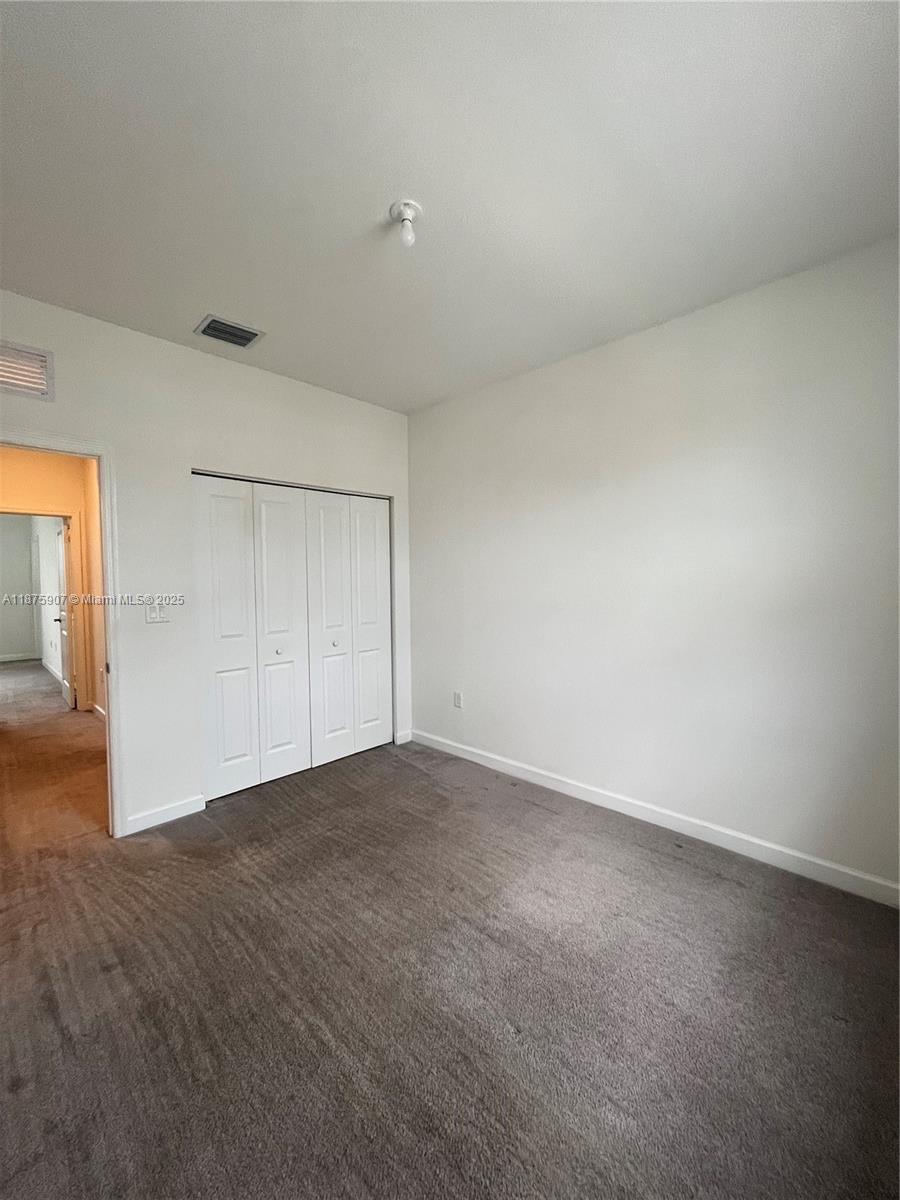 10008 Southwest 228th Terrace Miami, FL 33190 - Photo 29 of 46 a view of an empty room