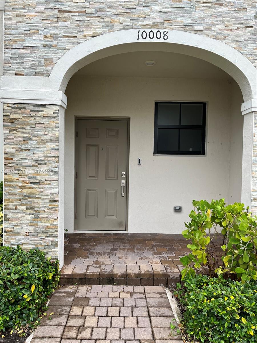 10008 Southwest 228th Terrace Miami, FL 33190 - Photo 3 of 46 a view of a door of the house
