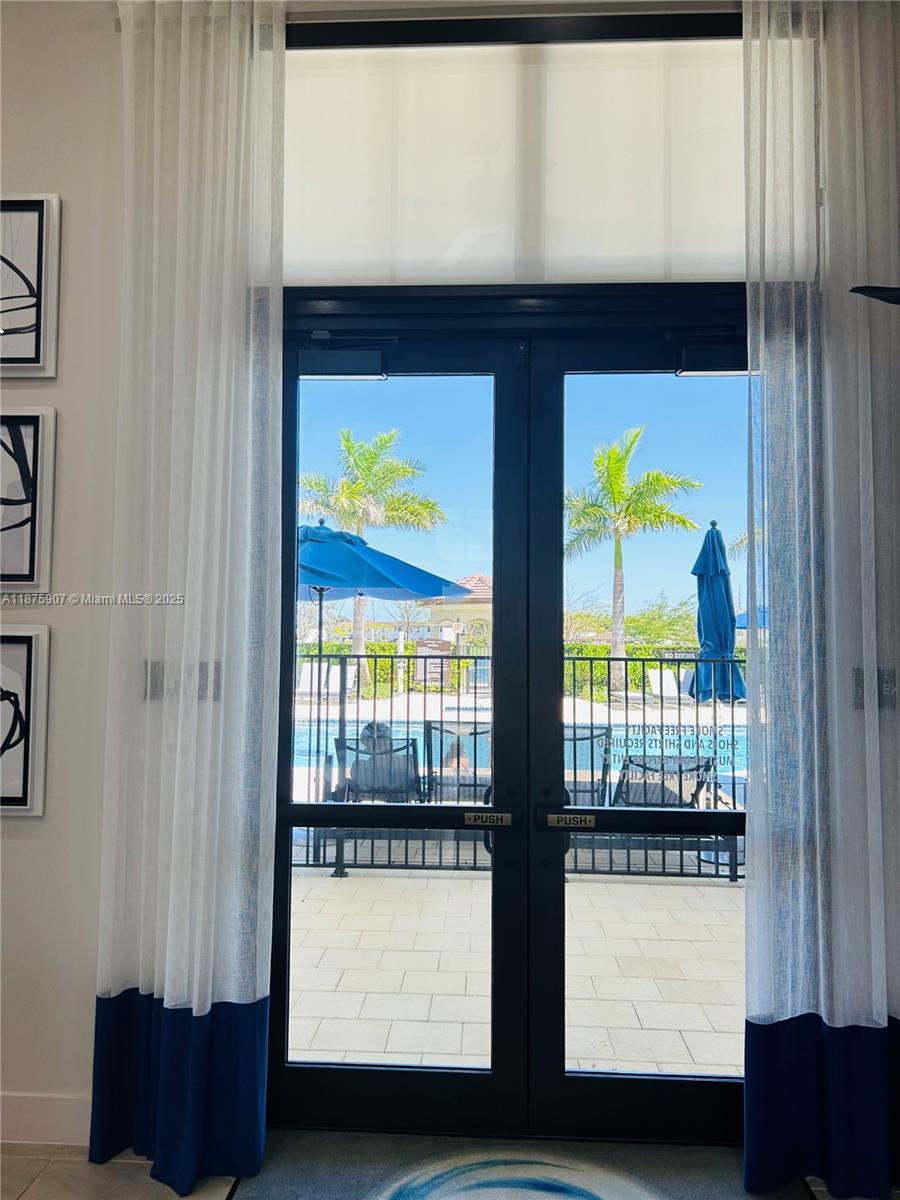 10008 Southwest 228th Terrace Miami, FL 33190 - Photo 38 of 46 a view of an entryway with a lot of furniture