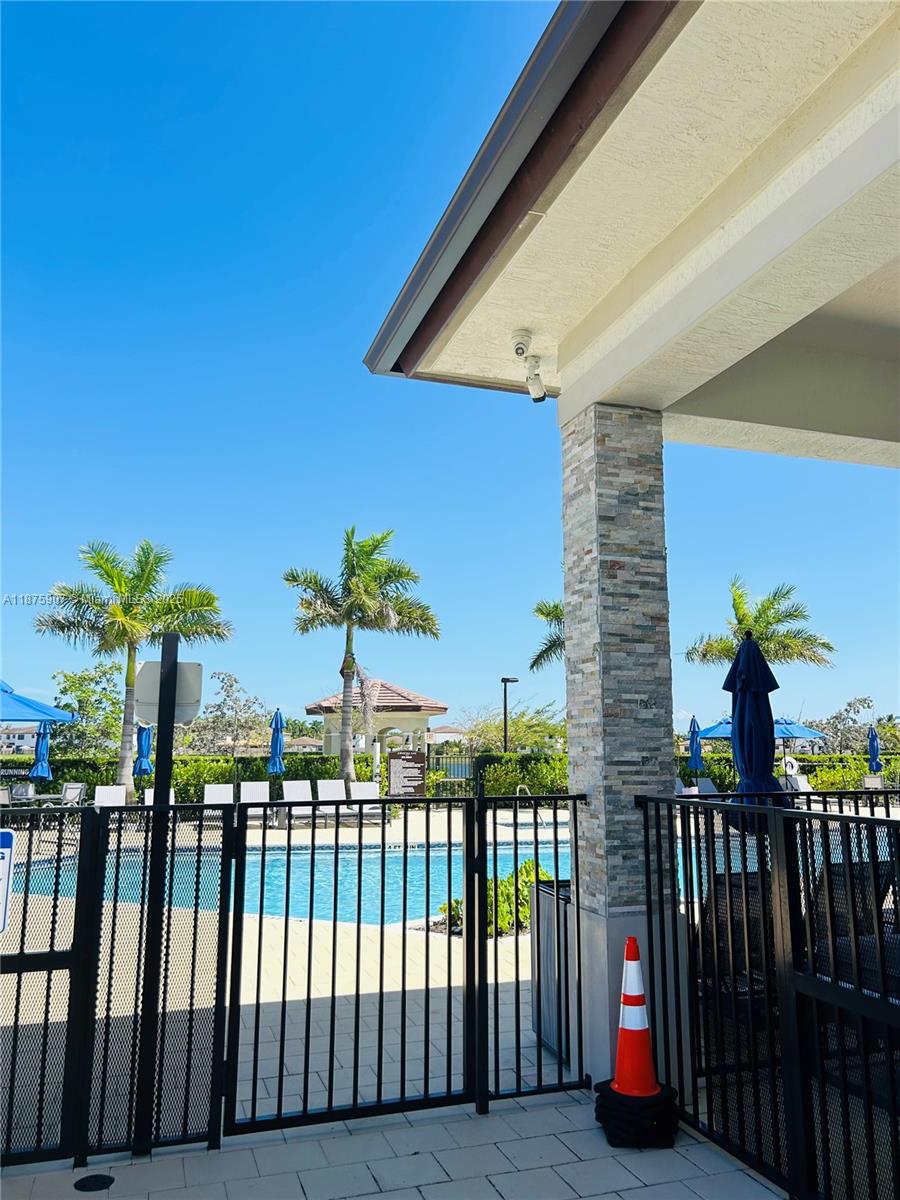 10008 Southwest 228th Terrace Miami, FL 33190 - Photo 40 of 46 a view of balcony with wooden floor and fence