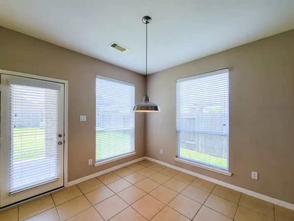 a bathroom with a sink toilet and a mirror