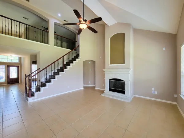 a view interior of a house an entryway and fire place