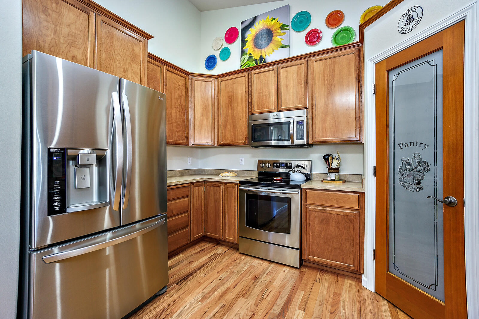 890 Ridgeview Drive Eagle Point, OR 97524 - Photo 14 of 35 a kitchen with stainless steel appliances and a refrigerator