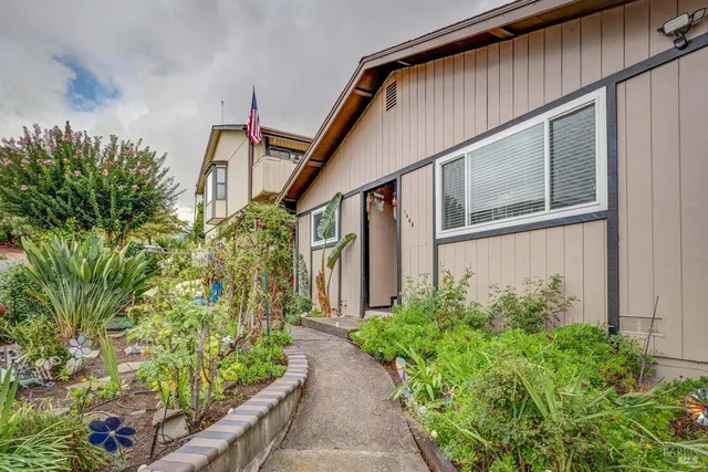 a house with plant in front of it