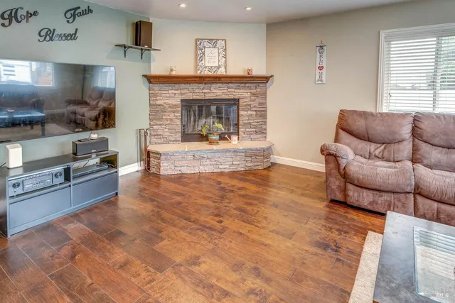 a living room with furniture and a fireplace