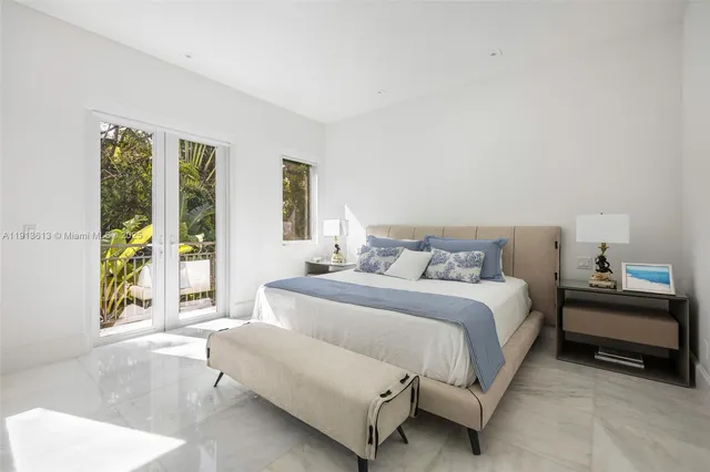 a bedroom with a bed and a couch