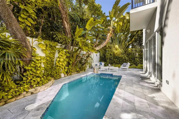 a view of a yard with an outdoor space