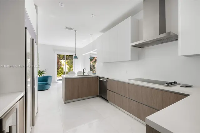 a kitchen with cabinets and a stove top oven