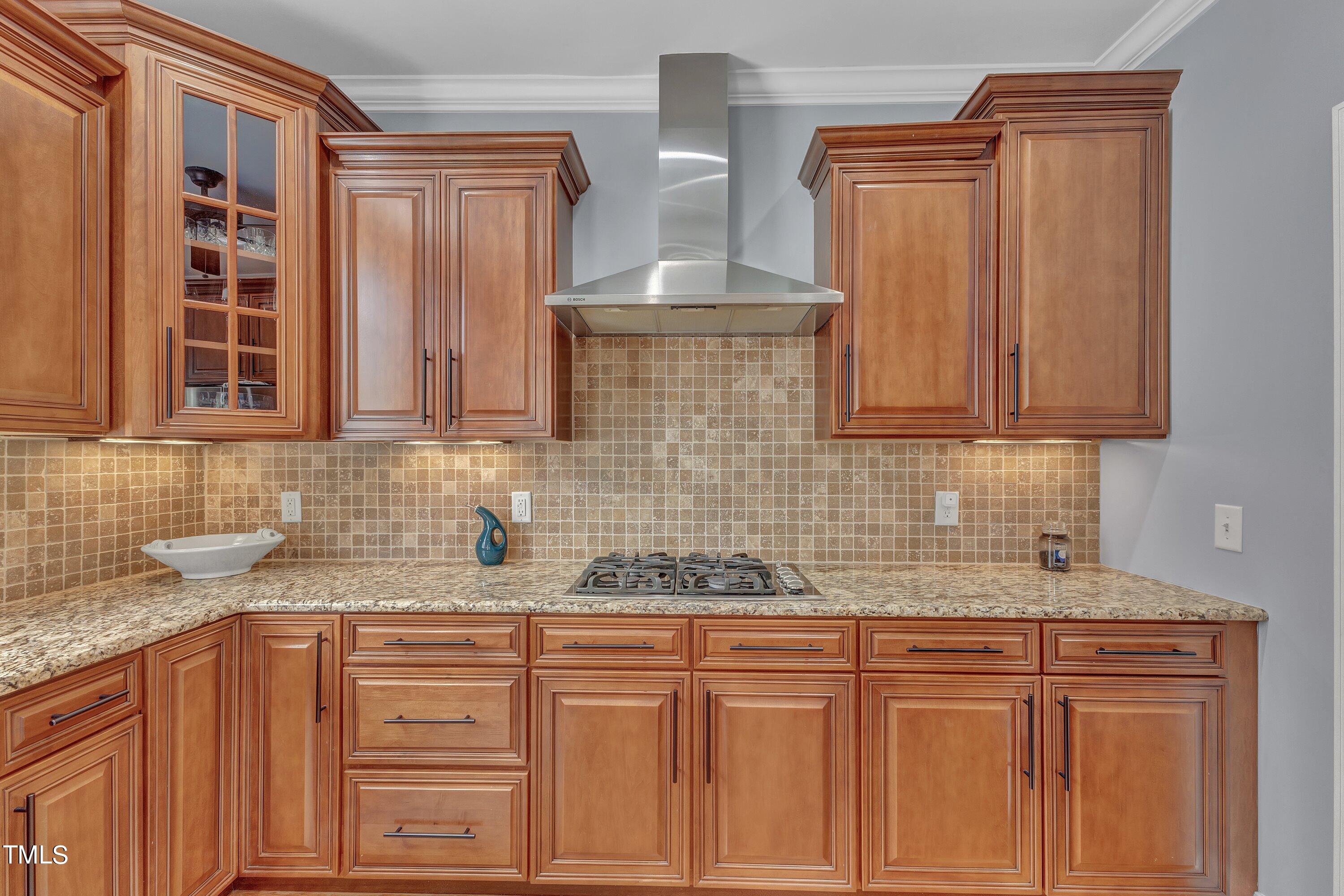 1741 Dunn Maple Drive Wake Forest, NC 27587 - Photo 17 of 63 a kitchen with granite countertop a sink stainless steel appliances and cabinets
