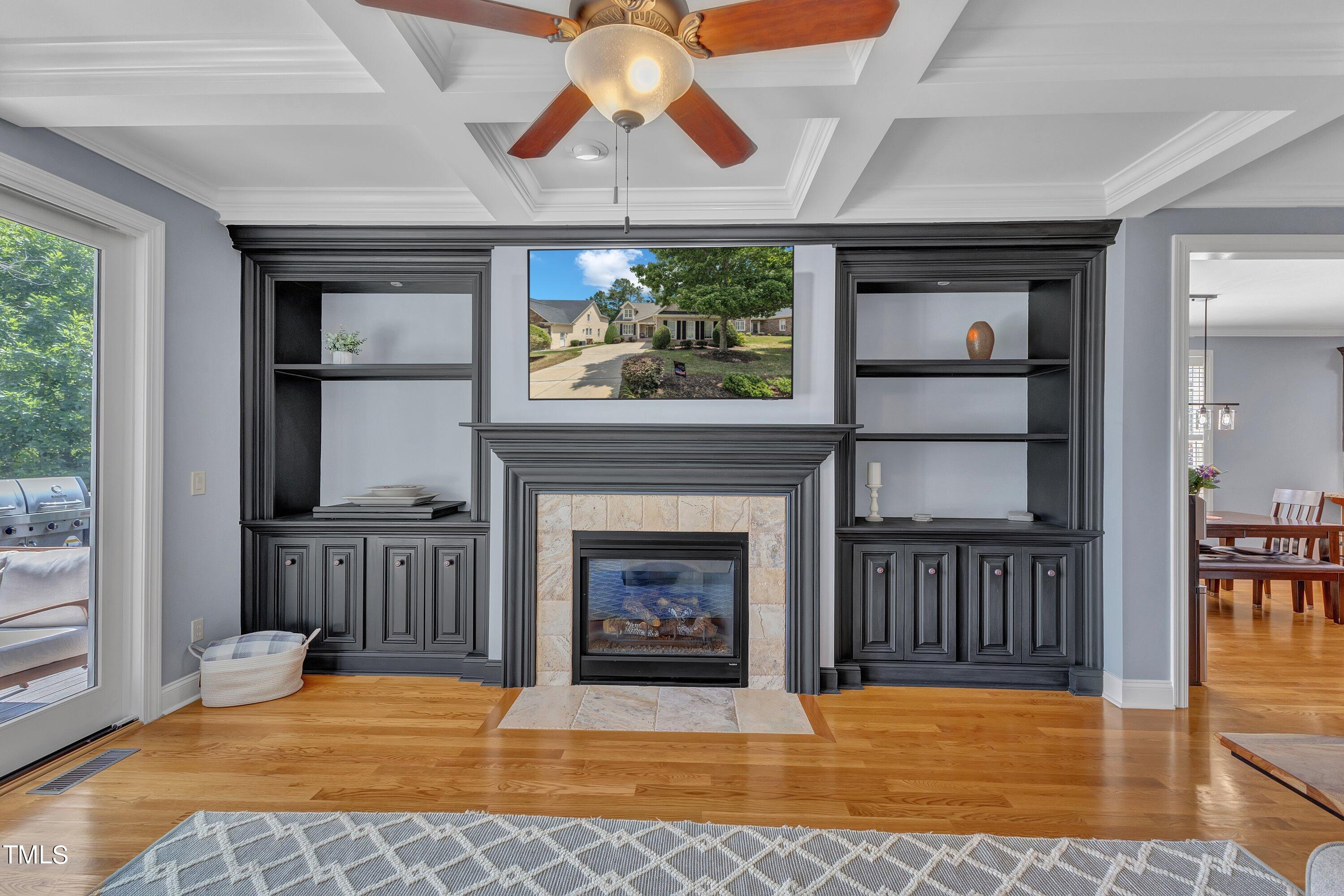 1741 Dunn Maple Drive Wake Forest, NC 27587 - Photo 21 of 63 a view of an empty room with wooden floor fireplace and a window