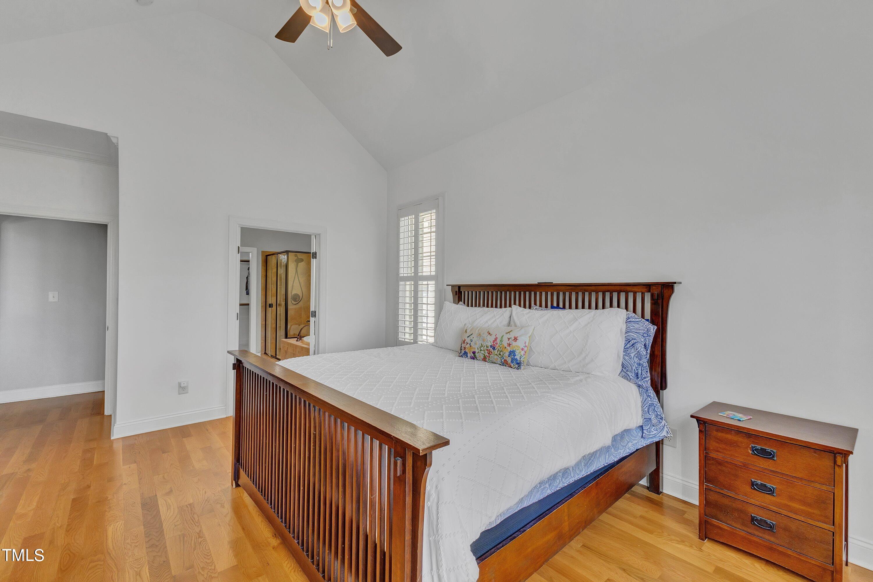 1741 Dunn Maple Drive Wake Forest, NC 27587 - Photo 27 of 63 a bedroom with a bed and wooden floor