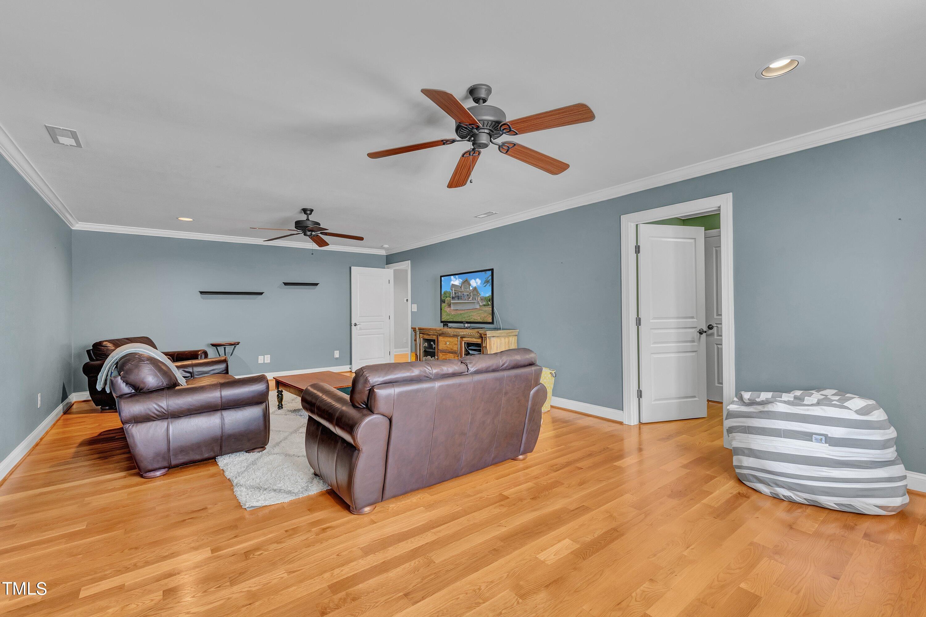 1741 Dunn Maple Drive Wake Forest, NC 27587 - Photo 43 of 63 a living room with furniture and a wooden floor