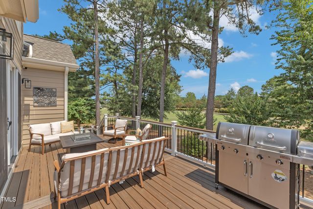 a view of house with a chairs and table in a patio