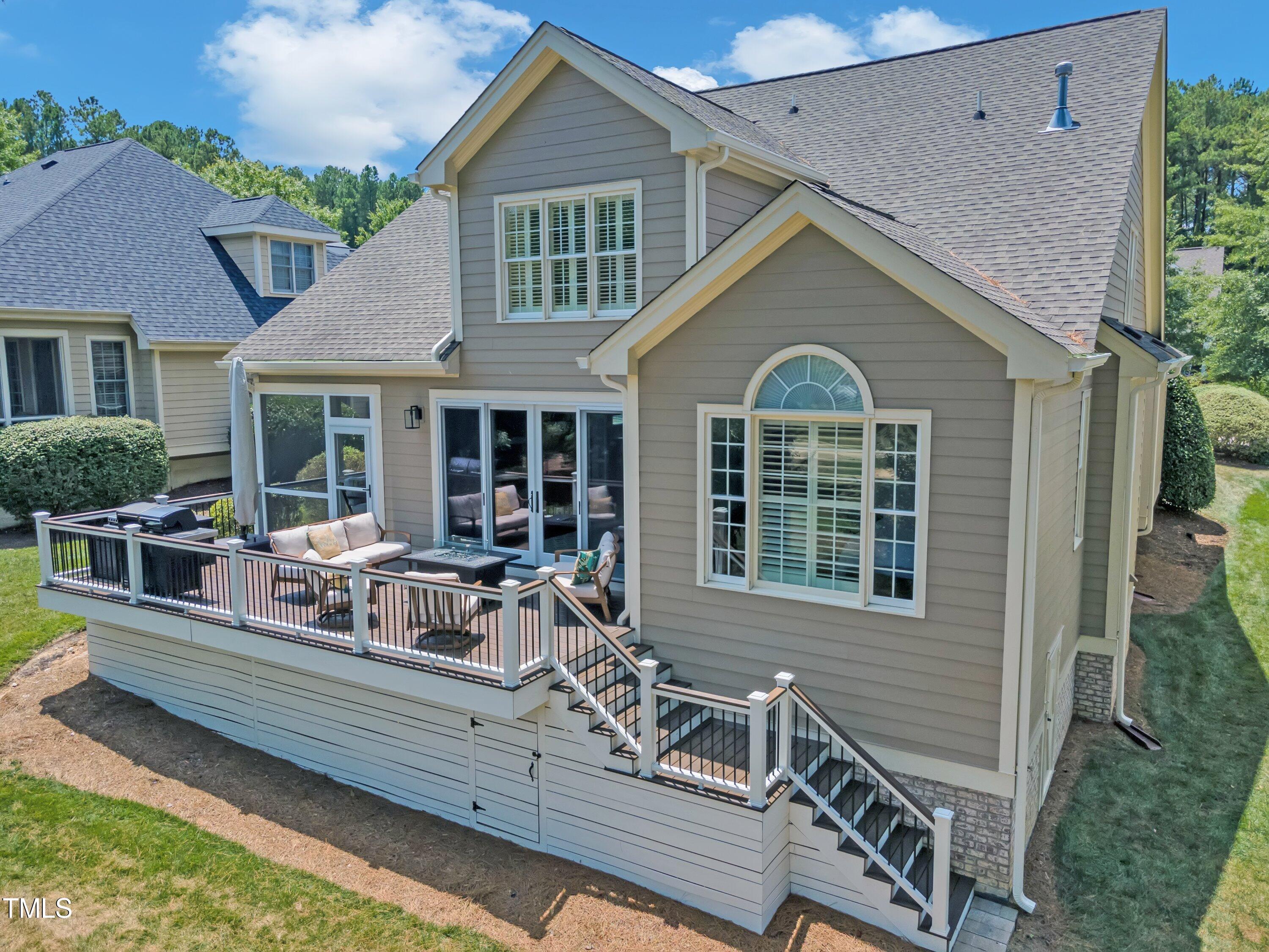 1741 Dunn Maple Drive Wake Forest, NC 27587 - Photo 52 of 63 a view of house with a chairs and table in a patio