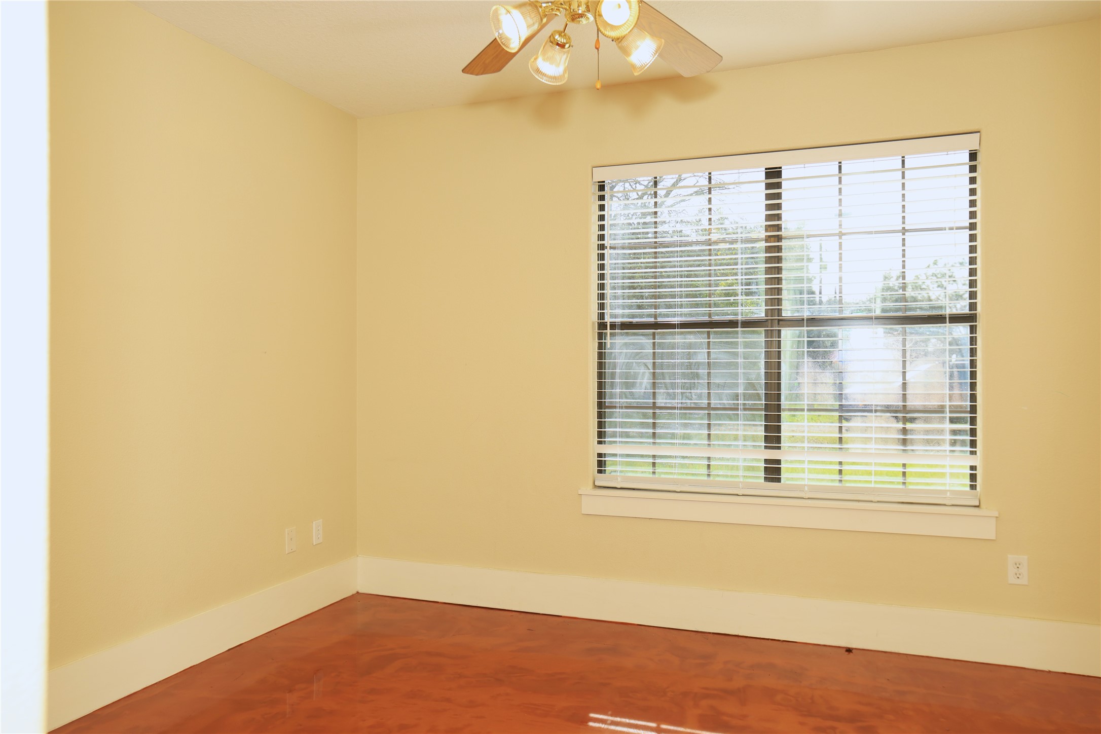 218 Hickory Street Sweeny, TX 77480 - Photo 8 of 13 a view of an empty room with wooden floor and a window