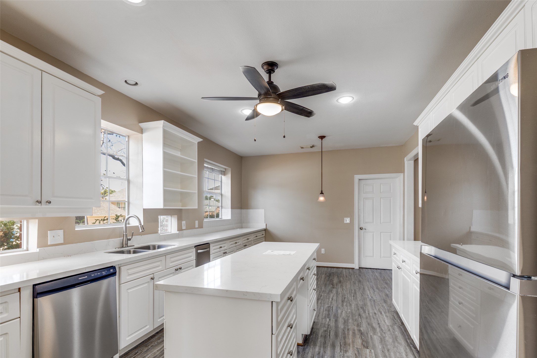 19026 Owen Oak Drive Humble, TX 77346 - Photo 11 of 25 a kitchen with a sink stove and refrigerator