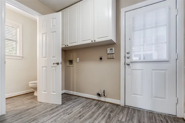 a bathroom with a sink a mirror and a window