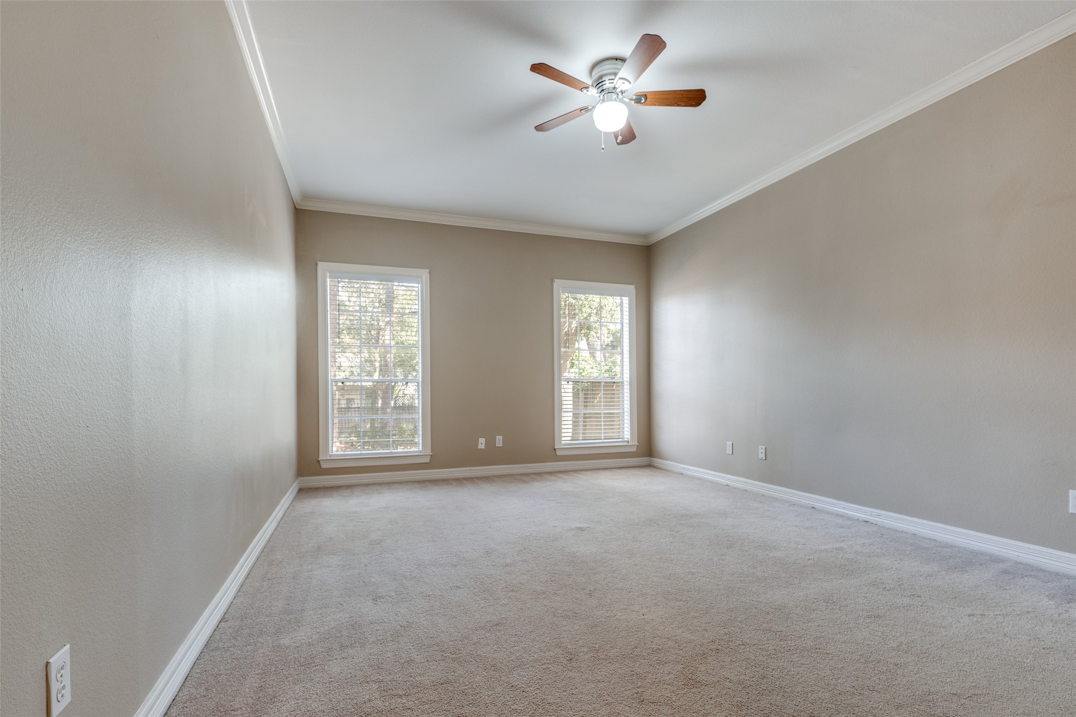 19026 Owen Oak Drive Humble, TX 77346 - Photo 17 of 25 a view of an empty room with a window and a kitchen