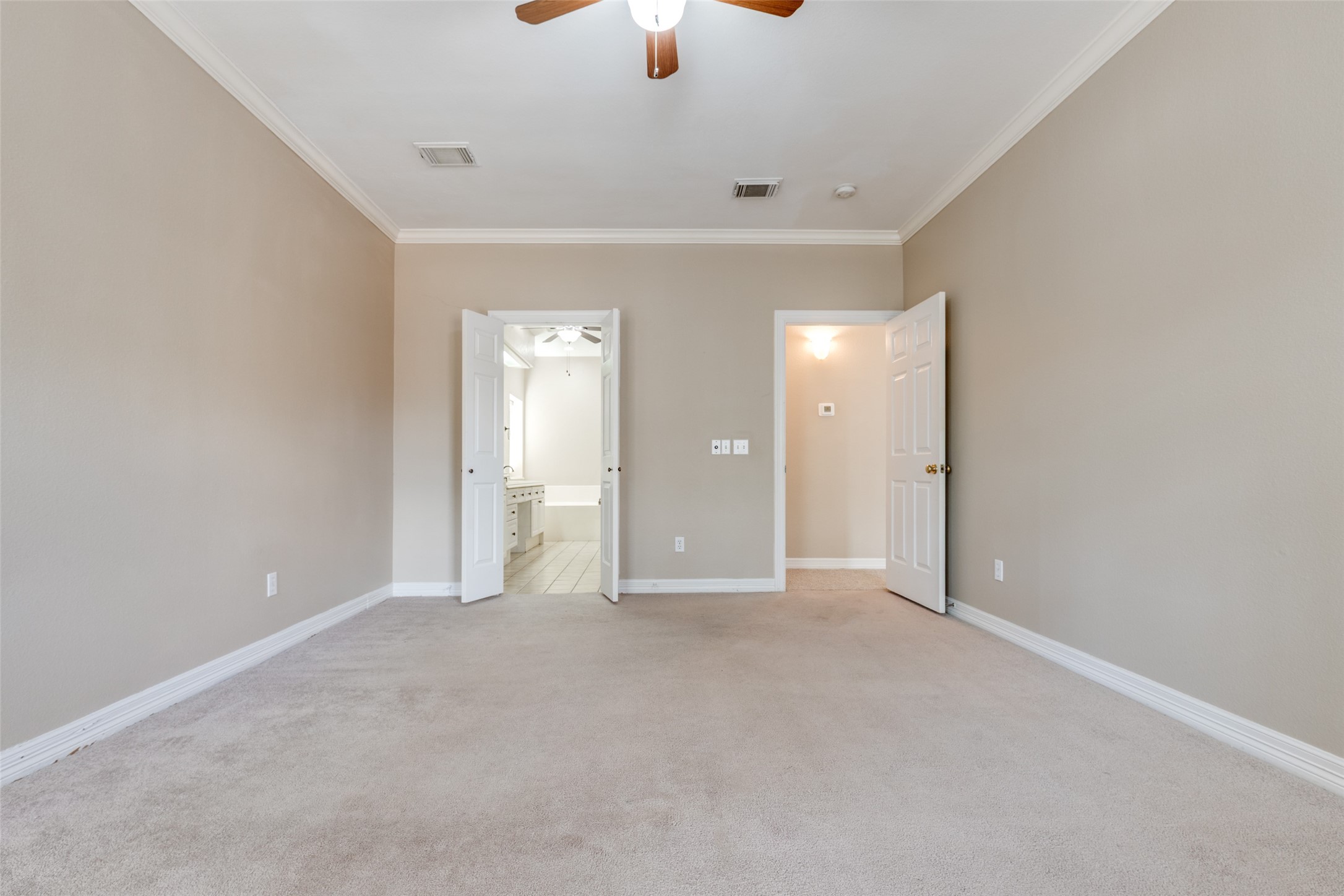 19026 Owen Oak Drive Humble, TX 77346 - Photo 18 of 25 a view of an empty room with a ceiling fan