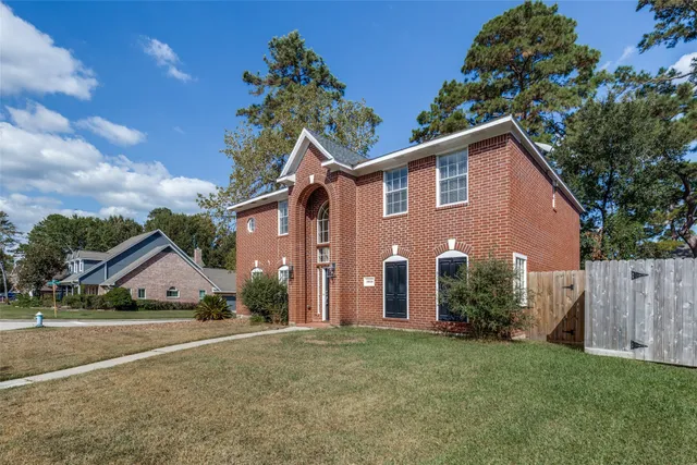a view of house with backyard