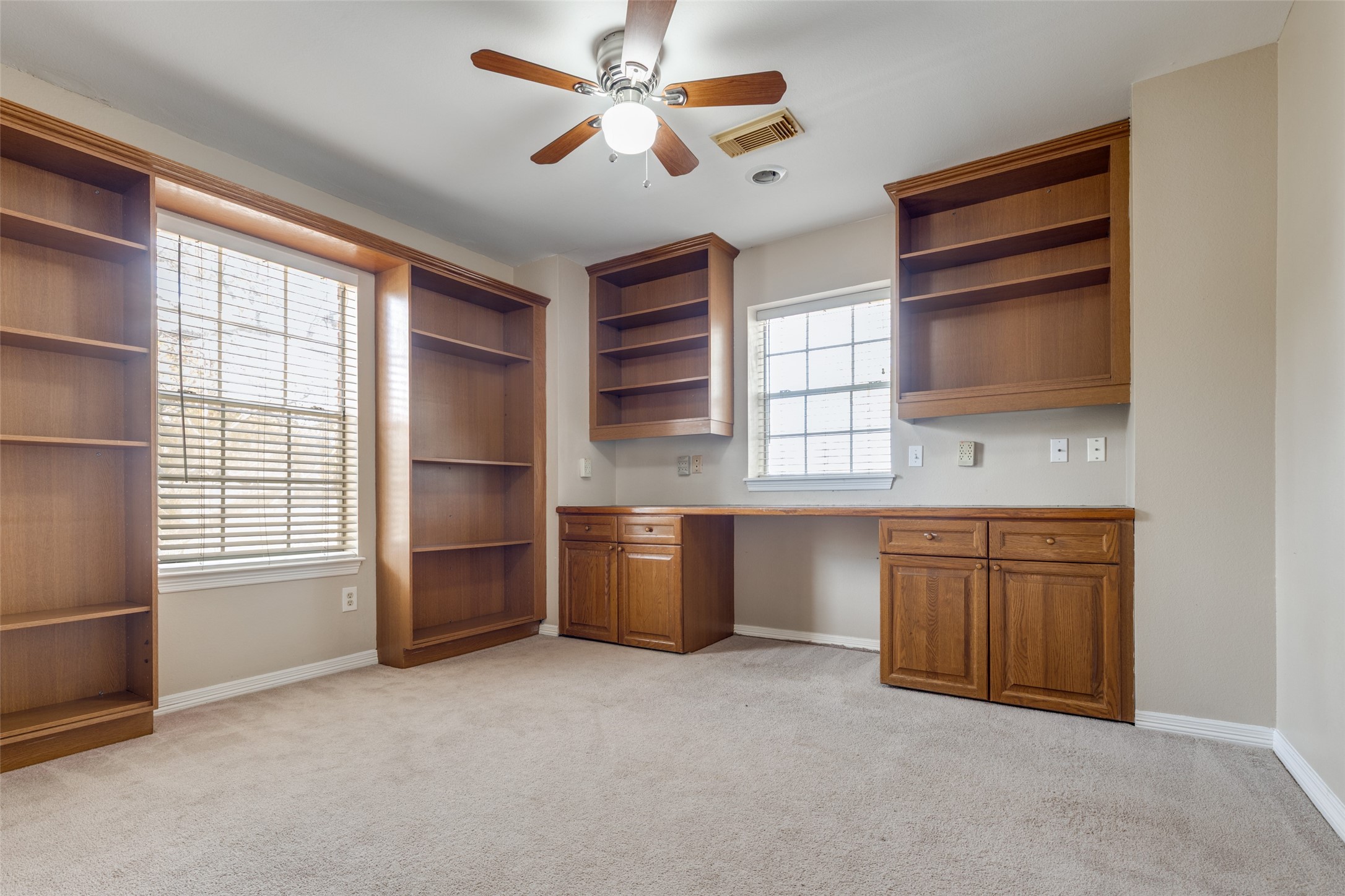 19026 Owen Oak Drive Humble, TX 77346 - Photo 22 of 25 a room with window and ceiling fan