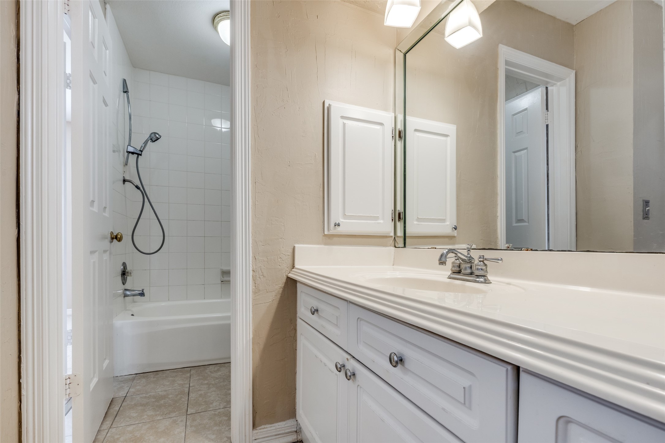 19026 Owen Oak Drive Humble, TX 77346 - Photo 24 of 25 a bathroom with a sink double vanity and a bathtub