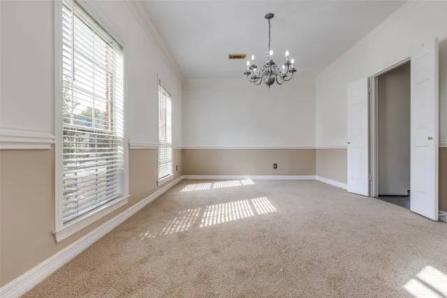a view of empty room with a fireplace
