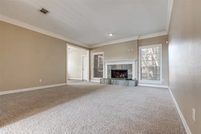 a view of an empty room with a fireplace