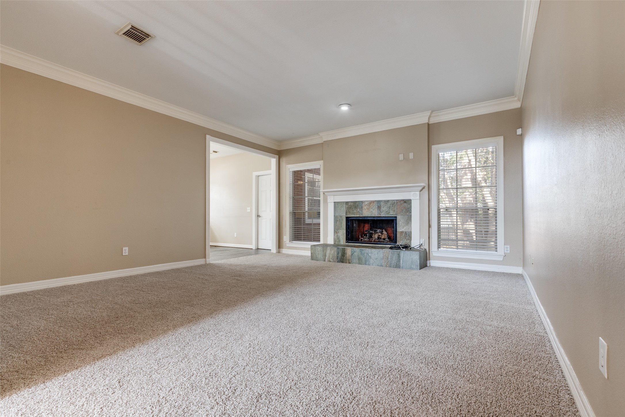 19026 Owen Oak Drive Humble, TX 77346 - Photo 7 of 25 a view of empty room with a fireplace