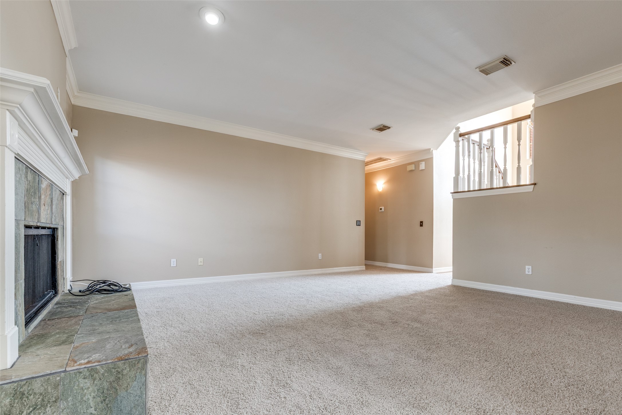 19026 Owen Oak Drive Humble, TX 77346 - Photo 8 of 25 a view of an empty room with a fireplace