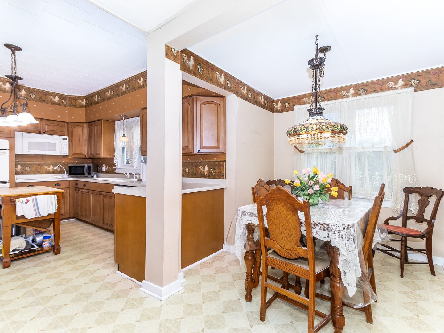 13561 West Kennedy Road Manhattan, IL 60442 - Photo 7 of 28 a view of a dining room with furniture and a chandelier