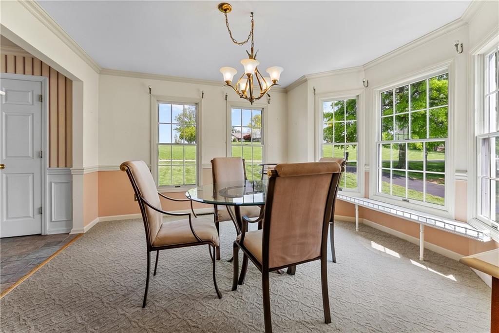 16 McBride Road Canonsburg, PA 15317 - Photo 11 of 43 Formal dining room with bay window, crown molding, and chair rail detailing