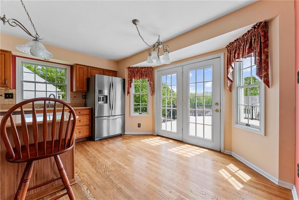 16 McBride Road Canonsburg, PA 15317 - Photo 21 of 43 Open and inviting eat-in kitchen with granite countertops island, solid oak cabinets, pantry, and French doors to the Trex deck