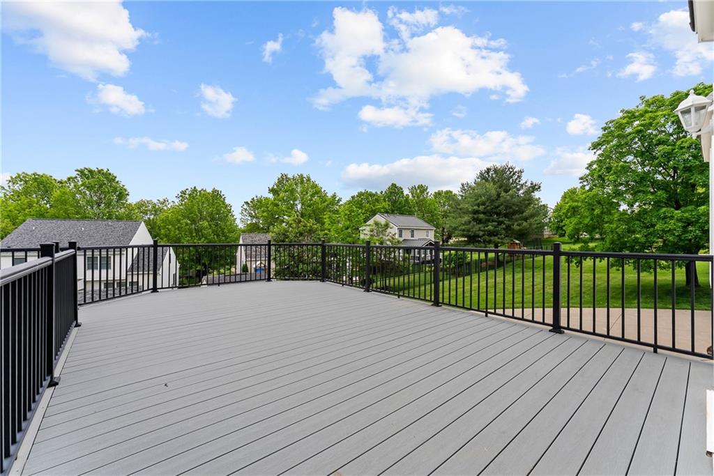 16 McBride Road Canonsburg, PA 15317 - Photo 36 of 43 Expansive Trex Deck off the kitchen with retractable awning and steps leading to the yard and lower patio.