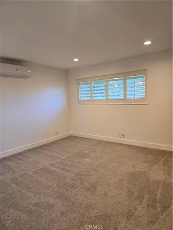 an empty room with a empty space and window