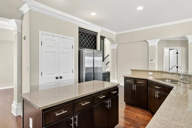 a kitchen with a sink and cabinets