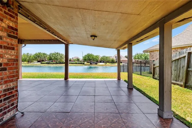a view of a swimming pool with a porch