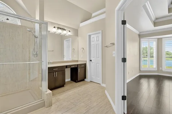 a spacious bathroom with a tub shower and sink