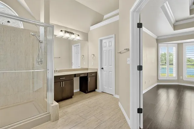 a spacious bathroom with a tub shower and sink